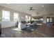 Bright living room with an open floor plan connecting the kitchen and dining areas, perfect for modern living and entertaining at 5546 Tart Blvd, Indianapolis, IN 46239