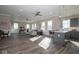 Open concept living space blending the living room, kitchen, and dining area, filled with natural light and modern finishes at 5546 Tart Blvd, Indianapolis, IN 46239