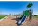Community playground featuring a slide, swings, and climbing structure for enjoyment at 5546 Tart Blvd, Indianapolis, IN 46239