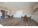 Cozy sitting area with stylish chairs, a bistro table, and seamless access to the outdoors, ideal for casual gatherings at 5546 Tart Blvd, Indianapolis, IN 46239