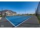 Community tennis courts with blue playing surface, black fencing, and well-maintained nets at 5546 Tart Blvd, Indianapolis, IN 46239