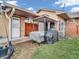 A cozy backyard featuring a patio area with seating, a grill, and easy access to the house at 606 Memorial Dr, Beech Grove, IN 46107
