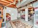 Finished basement featuring a large open room with painted walls, exposed ceiling, and room for many activities at 606 Memorial Dr, Beech Grove, IN 46107