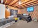 Finished basement bedroom with wood-paneled walls, carpeting, beds, and space for personalization at 606 Memorial Dr, Beech Grove, IN 46107
