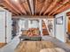 Basement living area featuring exposed ceiling and spacious open floor plan at 606 Memorial Dr, Beech Grove, IN 46107