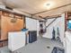 An open basement with a drop ceiling, painted walls, and space for a living or storage area at 606 Memorial Dr, Beech Grove, IN 46107