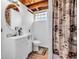 Bathroom featuring a white sink vanity, commode, and shower with privacy curtain at 606 Memorial Dr, Beech Grove, IN 46107