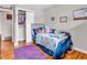 Charming bedroom features hardwood floors, and a closet for storage at 606 Memorial Dr, Beech Grove, IN 46107