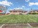 Charming single story home with large front yard and an American flag at 606 Memorial Dr, Beech Grove, IN 46107