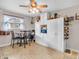 Bright eat-in kitchen featuring a ceiling fan and a range of storage options, including overhead cabinets at 606 Memorial Dr, Beech Grove, IN 46107