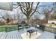 Back deck with outdoor seating overlooks the backyard and is perfect for entertaining or relaxing at 6179 Norwaldo Ave, Indianapolis, IN 46220