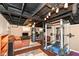 Finished basement includes a home gym, punching bag and seating area. Ready to workout! at 6179 Norwaldo Ave, Indianapolis, IN 46220