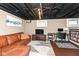 Finished basement with work area, a comfy leather couch, and a TV for relaxation and productivity at 6179 Norwaldo Ave, Indianapolis, IN 46220