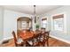 The dining room showcasing hardwood floors and a view into the cozy living room at 6179 Norwaldo Ave, Indianapolis, IN 46220