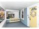 Inviting front porch with swing and yellow door at 6179 Norwaldo Ave, Indianapolis, IN 46220