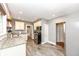 Galley kitchen with granite countertops, stainless steel appliances, and wood-look flooring at 6179 Norwaldo Ave, Indianapolis, IN 46220