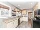 Bright kitchen featuring granite countertops, stainless steel appliances, and plenty of natural light at 6179 Norwaldo Ave, Indianapolis, IN 46220