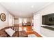 Bright and airy living room featuring hardwood floors and a cozy leather sofa at 6179 Norwaldo Ave, Indianapolis, IN 46220