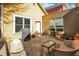 Backyard brick patio features outdoor seating, grill and lush green surroundings for outdoor enjoyment at 645 E 9Th St, Indianapolis, IN 46202