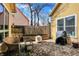 Backyard patio with brick flooring, seating, a grill and privacy fence at 645 E 9Th St, Indianapolis, IN 46202