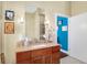Bathroom features a sleek vanity with a large mirror and contemporary lighting fixtures at 645 E 9Th St, Indianapolis, IN 46202