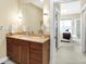 Bathroom showcasing a vanity with a sink and a glimpse of the bedroom at 645 E 9Th St, Indianapolis, IN 46202