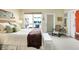 Relaxing bedroom with a rocking chair, natural light, and neutral décor at 645 E 9Th St, Indianapolis, IN 46202