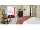 Cozy bedroom with a rocking chair and a glimpse of the walk-in closet at 645 E 9Th St, Indianapolis, IN 46202