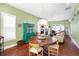 Charming dining room with a round wood table and a decorative teal hutch, offering an inviting space for meals at 645 E 9Th St, Indianapolis, IN 46202
