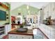 Bright and airy kitchen featuring modern appliances, white cabinetry, and a breakfast bar perfect for casual dining at 645 E 9Th St, Indianapolis, IN 46202
