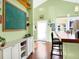 Charming kitchen showcasing a breakfast bar with barstool seating, adding a cozy spot for morning coffee or casual meals at 645 E 9Th St, Indianapolis, IN 46202