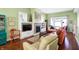 Cozy living room with a fireplace, comfortable seating, and open design leading to dining area at 645 E 9Th St, Indianapolis, IN 46202