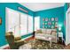 Inviting living room with a comfortable couch, armchair, and a large window for natural light at 645 E 9Th St, Indianapolis, IN 46202