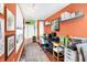 Bright home office space with hardwood floors, large windows for natural light, and multiple work stations at 645 E 9Th St, Indianapolis, IN 46202