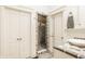 Modern bathroom featuring a glass-enclosed shower, white doors, and decorative tile accents at 6560 Dawson Lake Dr, Indianapolis, IN 46220
