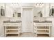 Bright bathroom with double sinks, custom cabinets, decorative mirrors, and a modern design at 6560 Dawson Lake Dr, Indianapolis, IN 46220