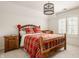 Comfortable bedroom with a wooden bed frame, nightstands, and a window with shutter blinds at 6560 Dawson Lake Dr, Indianapolis, IN 46220
