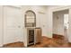 Convenient butler's pantry featuring a wine fridge, counter space and storage at 6560 Dawson Lake Dr, Indianapolis, IN 46220