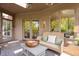 Cozy covered patio with comfortable seating and a view of the beautiful outdoor landscape at 6560 Dawson Lake Dr, Indianapolis, IN 46220