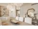 Bright dining room with a light-colored table, chandeliers, and stylish wall decor at 6560 Dawson Lake Dr, Indianapolis, IN 46220