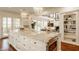 Bright, open kitchen featuring a large island with stone countertop and stainless steel appliances at 6560 Dawson Lake Dr, Indianapolis, IN 46220