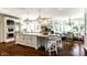 Spacious white kitchen with large island, stainless steel appliances, hardwood floors, and breakfast nook at 6560 Dawson Lake Dr, Indianapolis, IN 46220