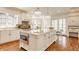 Large kitchen with granite countertops, stainless steel appliances, and a spacious center island with seating at 6560 Dawson Lake Dr, Indianapolis, IN 46220
