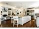 Open concept kitchen with island seating, stainless steel appliances, and access to living areas at 6560 Dawson Lake Dr, Indianapolis, IN 46220