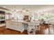Bright, modern kitchen with stainless steel appliances, an oversized island, and a breakfast nook at 6560 Dawson Lake Dr, Indianapolis, IN 46220