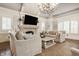Inviting living room with a fireplace, comfortable seating, and natural light at 6560 Dawson Lake Dr, Indianapolis, IN 46220