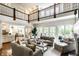 Spacious living room with two-story ceilings, hardwood floors, and lots of seating at 6560 Dawson Lake Dr, Indianapolis, IN 46220