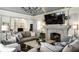Inviting living room featuring a stone fireplace, vaulted ceilings, and comfortable seating at 6560 Dawson Lake Dr, Indianapolis, IN 46220