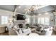 Cozy living room with vaulted ceilings, stone fireplace, and neutral furniture at 6560 Dawson Lake Dr, Indianapolis, IN 46220