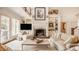 Inviting living room featuring a stone fireplace, built-in shelves, and ample seating at 6560 Dawson Lake Dr, Indianapolis, IN 46220